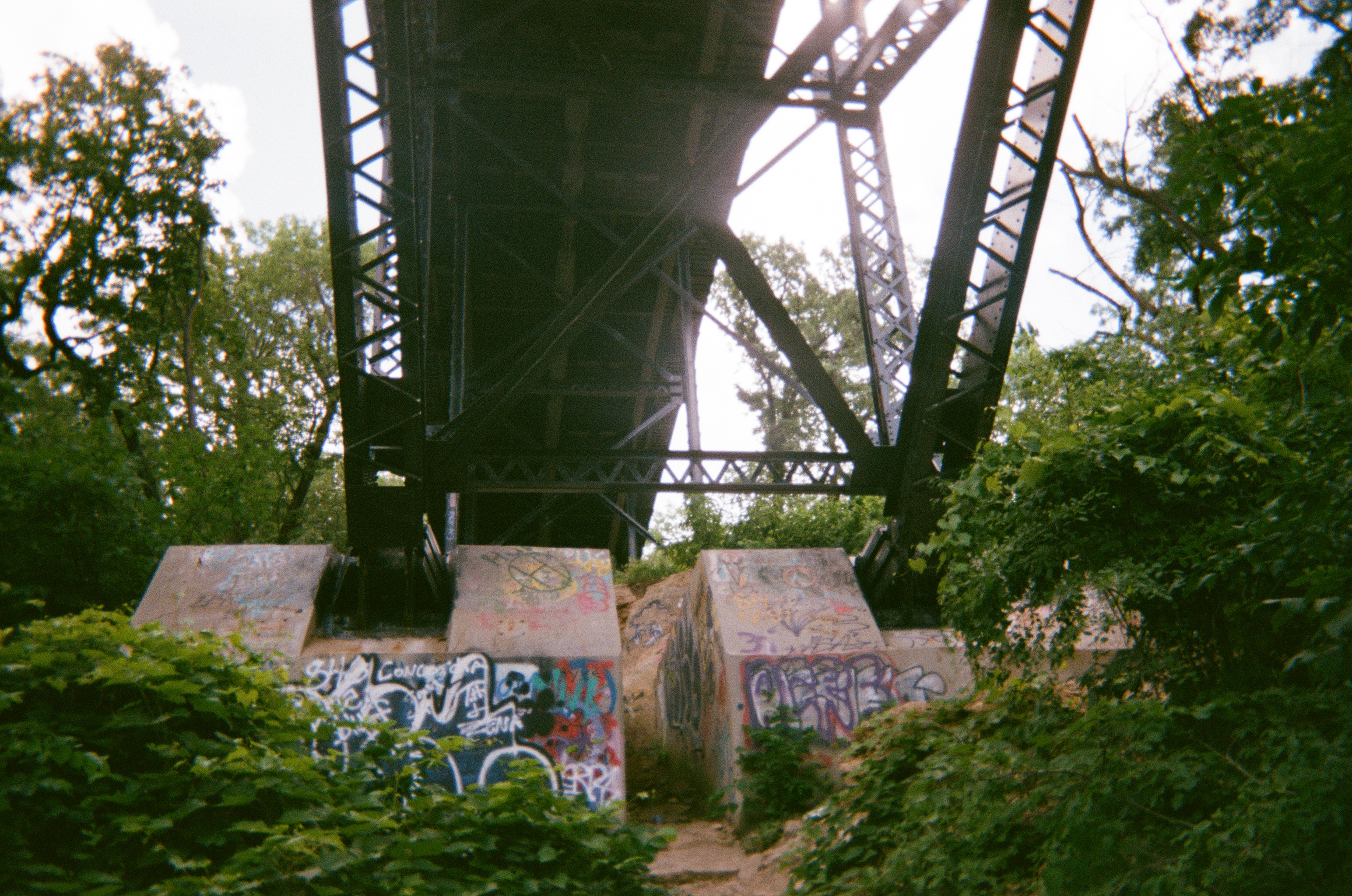 underside of bridge full of graffiti